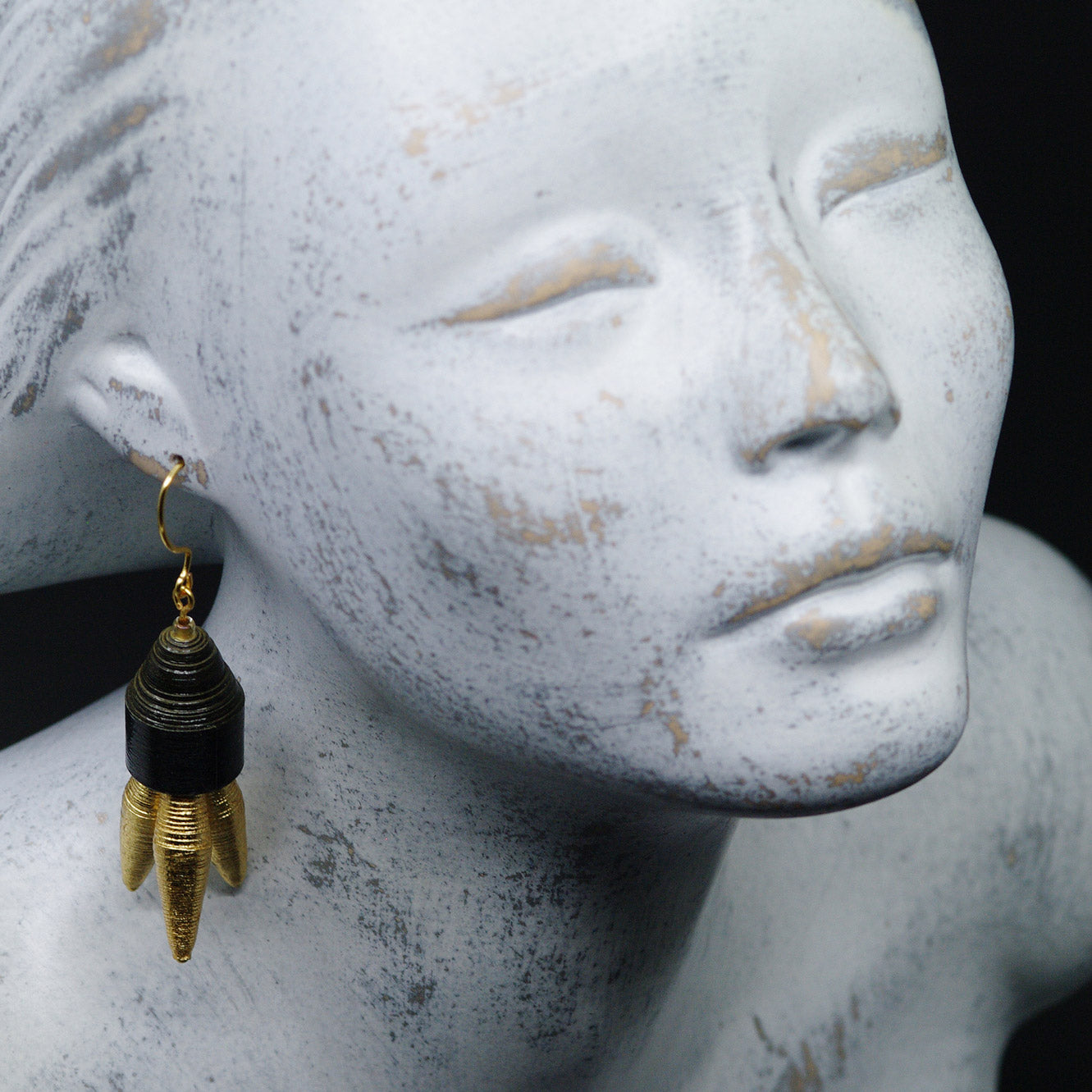 Black and Golden Tripod Paper Earrings on Model Back to Black Collection Chiramo Paper Jewelry
