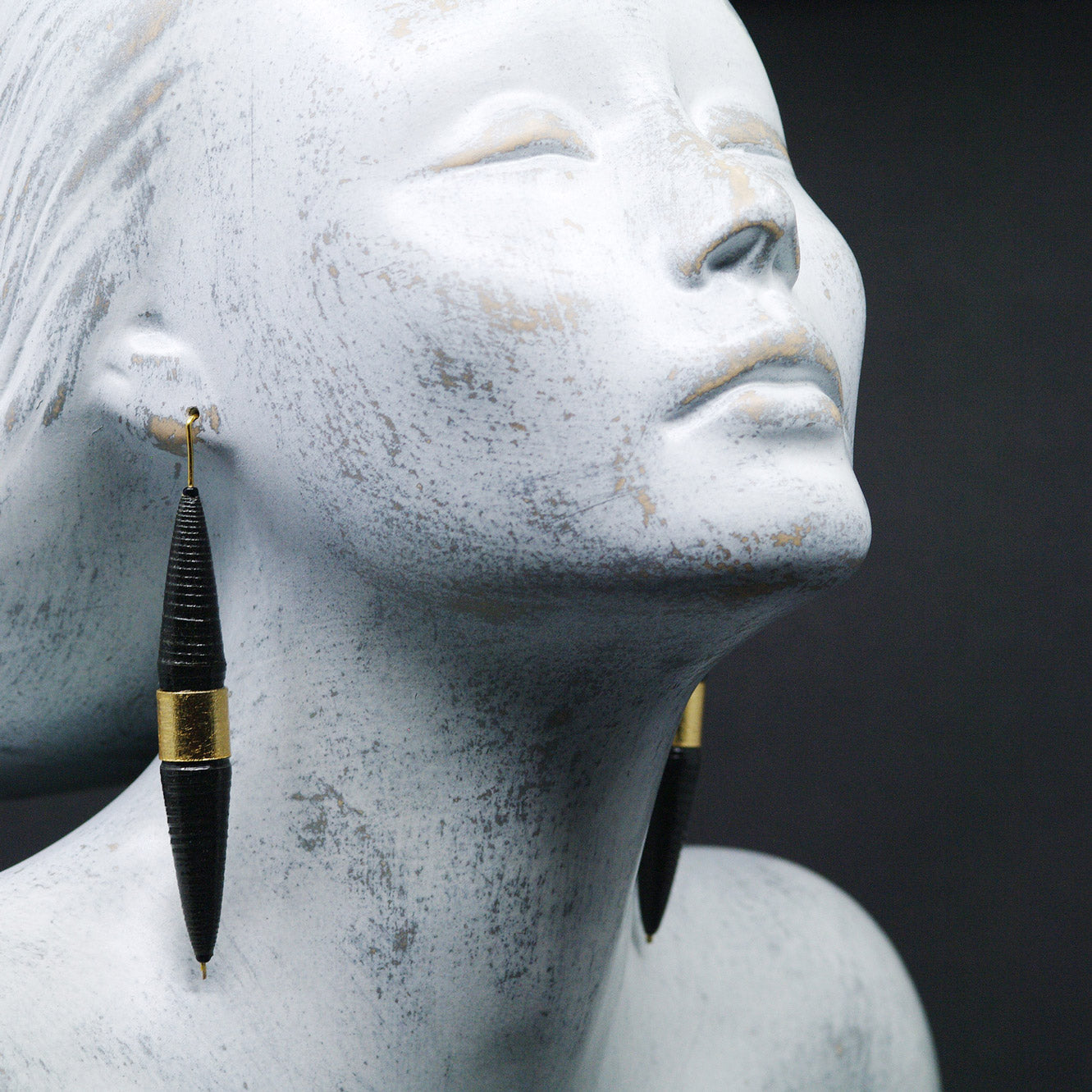 Long Biconical Black and Gold Paper Earrings on Model. Back to Black Collection by Chiramo Paper Jewelry